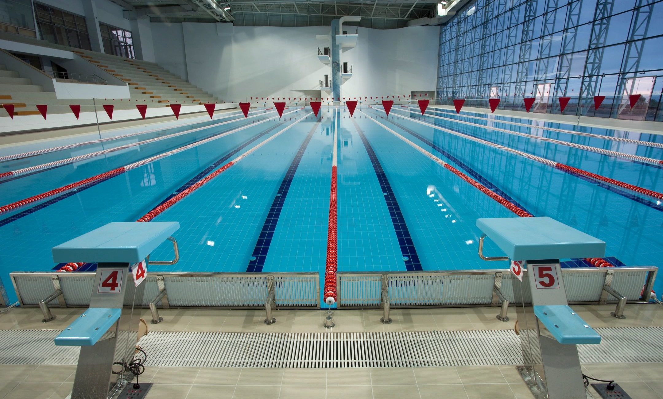 Indoor natatorium with olympic sized pool and large windows