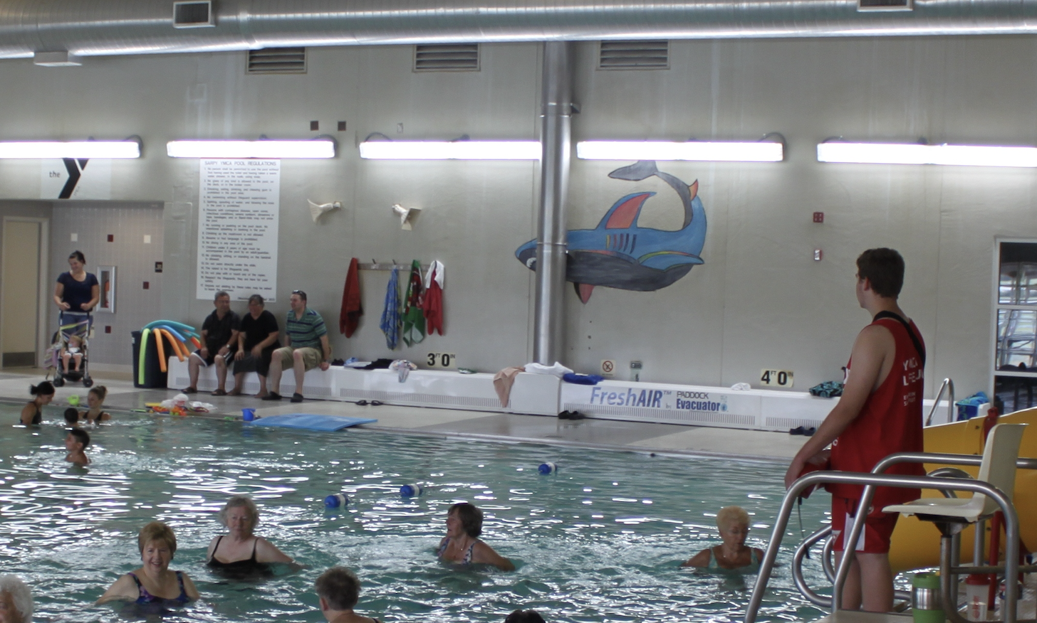 Paddock Evacuator bench in an indoor YMCA pool. Source capture exhaust for removing chloramines and bad air quality.