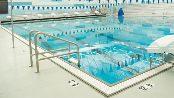 pool gutters vs. skimmers, rec center, high school pool