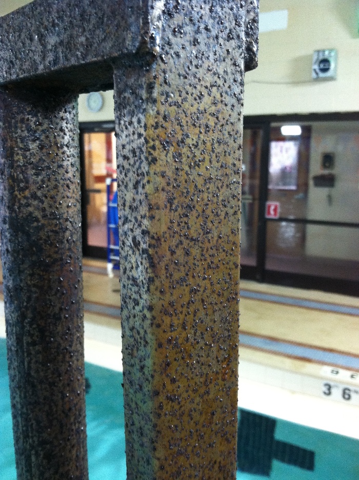 Severe corrosion on a stainless steel chair lift in an indoor swimming pool, due to chloramines.